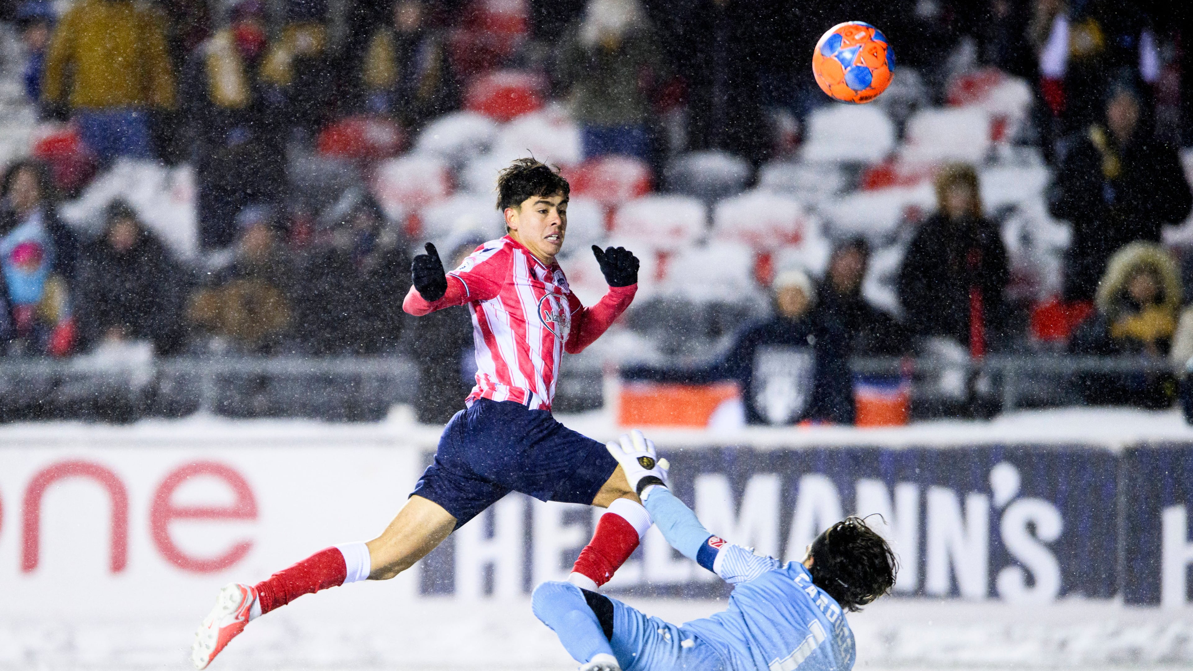 Atletico Ottawa's David Rodríguez (7) scores on Cavalry FC's Ali Musse (7) during extra time Canadian Premier League finals soccer action in Ottawa, on Sunday, Nov. 9, 2025. (Spencer Colby/The Canadian Press via AP)