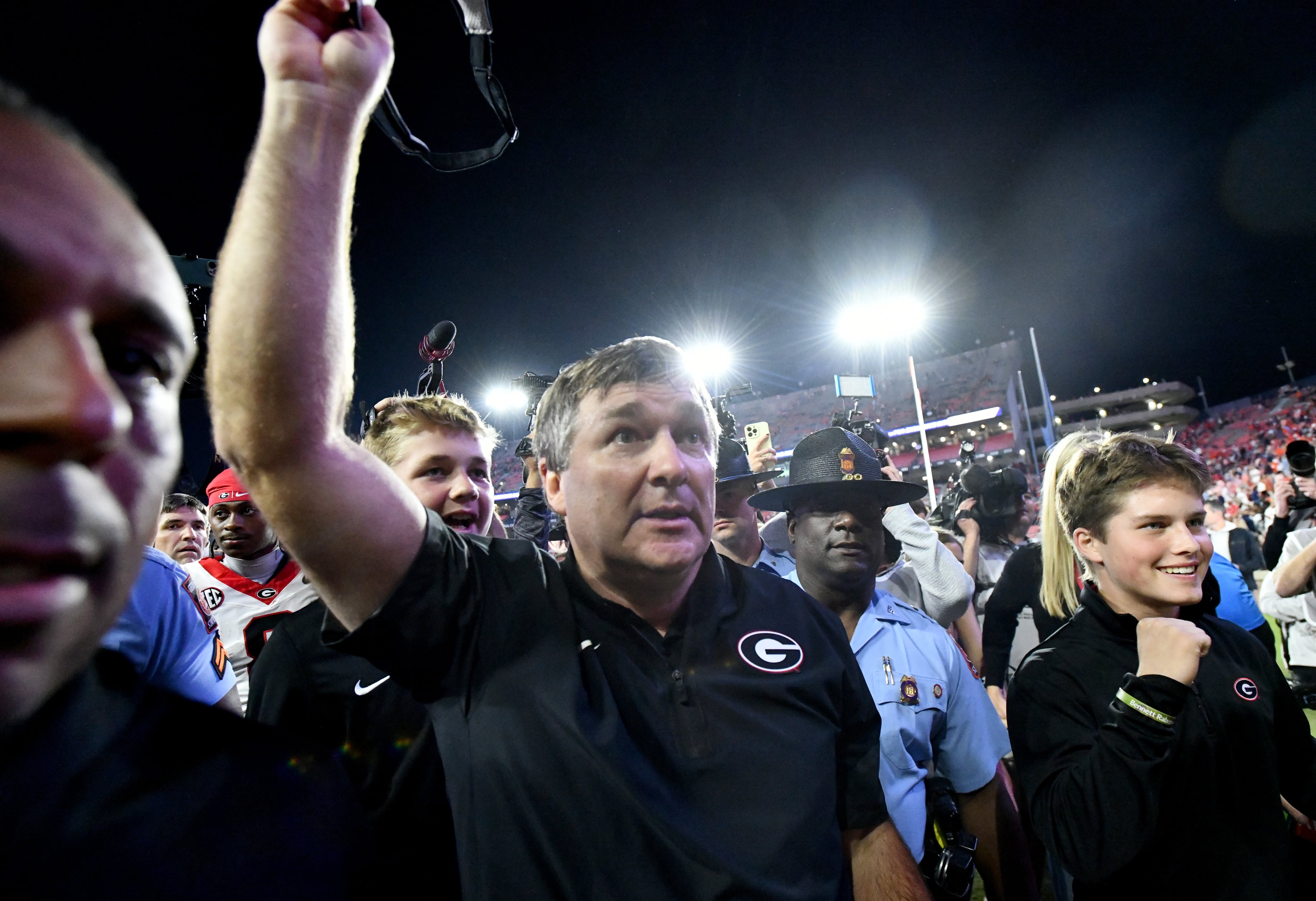 Georgia head coach Kirby Smart celebrates as he leaves the field after Georgia beat Auburn during a NCAA college football game at Jordan-Hare Stadium, Saturday, October 11, 2025, in Auburn, Ala. Georgia won 20-10 overAuburn. (Hyosub Shin / AJC)