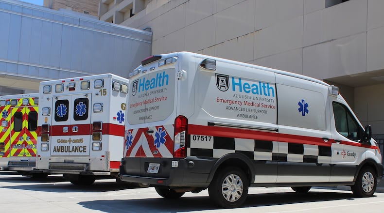 A Grady EMS van waits to transport non-emergency patients at the emergency room of the Augusta University of Medical Center.