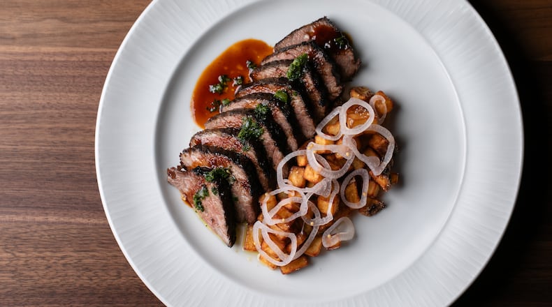 The short rib from Austin's at Serenbe comes brushed in fermented honey and served with crushed herbs, potatoes, chilis, garlic and pickled shallots. / Courtesy of Erik Meadows Photography