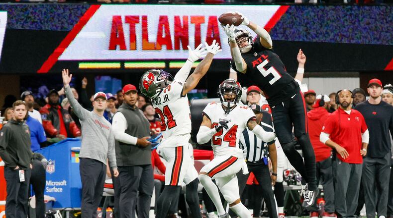 Atlanta Falcons wide receiver Drake London (5) goes up for an impressive reception during the fourth quarter against the Tampa Bay Buccaneers on Sunday, Dec. 10, 2023,  at Mercedes-Benz Stadium in Atlanta. 
Miguel Martinez/miguel.martinezjimenez@ajc.com