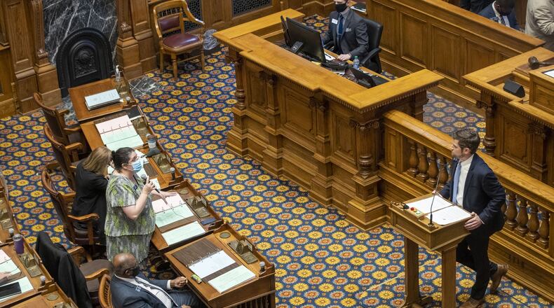 Sen. Brian Strickland (R-McDonough), right, answers a question from Sen. Zahra Karinshak (D-Duluth), left, as he presents HB 987 in the Senate Chambers on Friday at the Georgia State Capitol. (ALYSSA POINTER / ALYSSA.POINTER@AJC.COM)