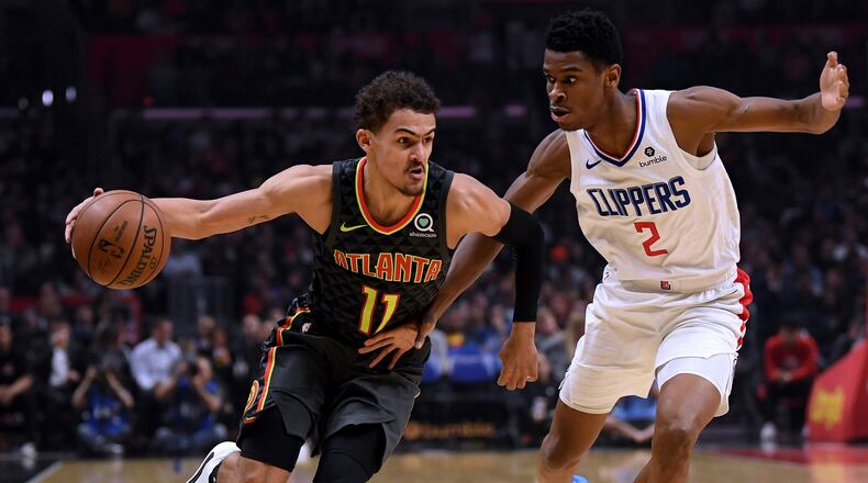 Trae Young of the Atlanta Hawks drives on Shai Gilgeous-Alexander of the LA Clippers during a 123-118 Hawks win at Staples Center on January 28, 2019 in Los Angeles, California. (Photo by Harry How/Getty Images)