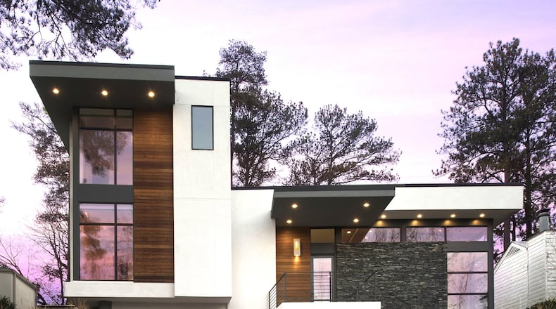 The custom design of the Spring Valley home was inspired by the owners’ love of cantilevers, angles and levels. The home’s exterior consists of a combination of stucco, Ipe wood veneer and natural stone. Contributed by Galina Coada