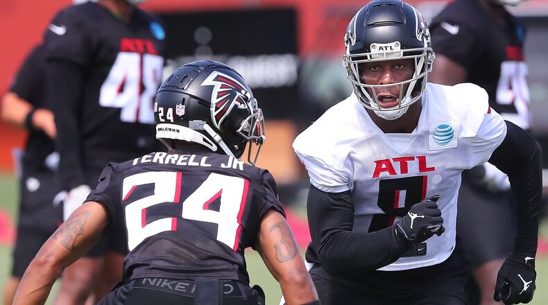 Falcons cornerback A.J. Terrell (left) defends against tight end Kyle Pitts during the fourth day of training camp practice Sunday, Aug. 1, 2021, in Flowery Branch. (Curtis Compton / Curtis.Compton@ajc.com)