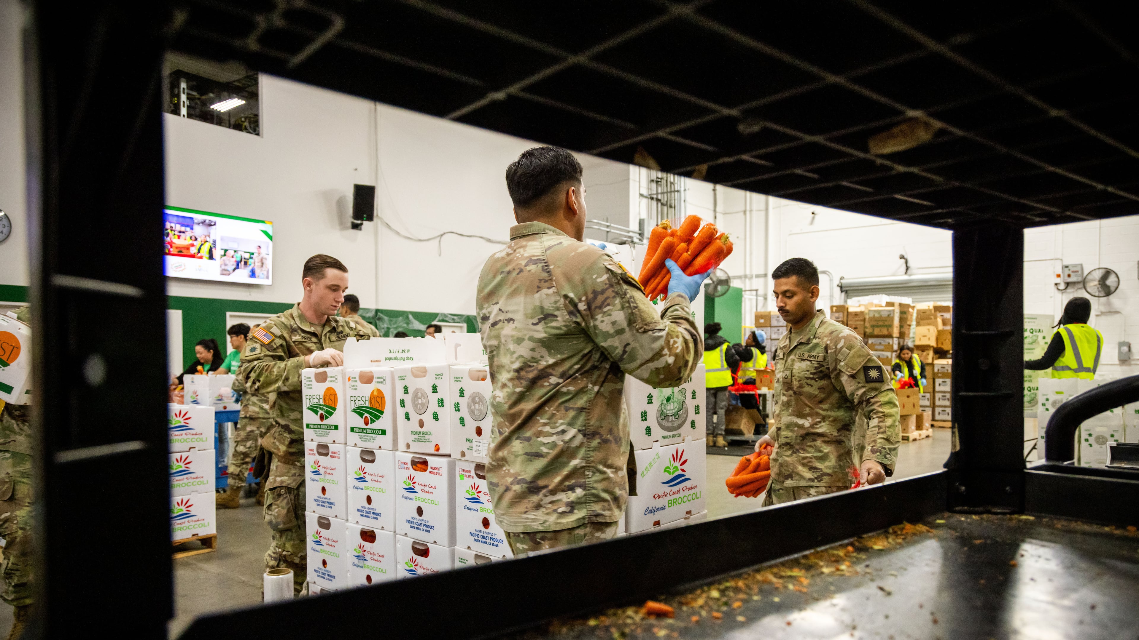 California National Guard sort produce at the Los Angeles Food Bank Wednesday, Oct. 29, 2025, in Los Angeles. (AP Photo/Ethan Swope)
