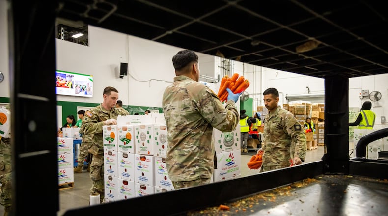 California National Guard sort produce at the Los Angeles Food Bank Wednesday, Oct. 29, 2025, in Los Angeles. (AP Photo/Ethan Swope)