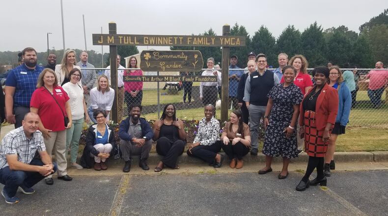 YMCA of Metro Atlanta representatives and other community members gathered on Wednesday, Oct. 12 to celebrate the opening of a new community garden at the J. M. Tull Gwinnett Family YMCA in Lawrenceville. COURTESY YMCA OF METRO ATLANTA