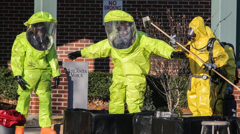 Atlanta firefighters responded to the Helene Mills Senior Center in downtown Atlanta around 8 a.m. Tuesday, March 22, 2016, with their decontamination and hazardous materials teams after a pool maintenance worker discovered a chemical leak in a pool storage area. JOHN SPINK / JSPINK@AJC.COM