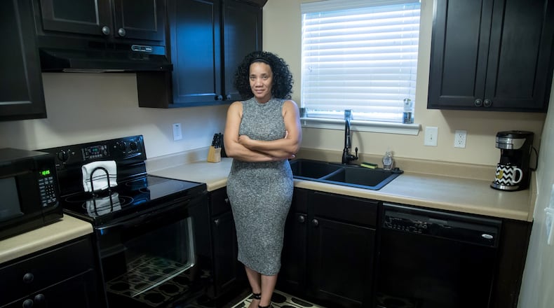 Jacqueline Atterberry in the kitchen of her Southwest Atlanta townhouse, which she had built in 2007. The housing bubble burst soon afterward, leaving her deeply ‘underwater.’ Atterberry hopes to be one of the 3,000 homeowners selected for the Underwater Georgia program, which would boost her equity. STEVE SCHAEFER / SPECIAL TO THE AJC