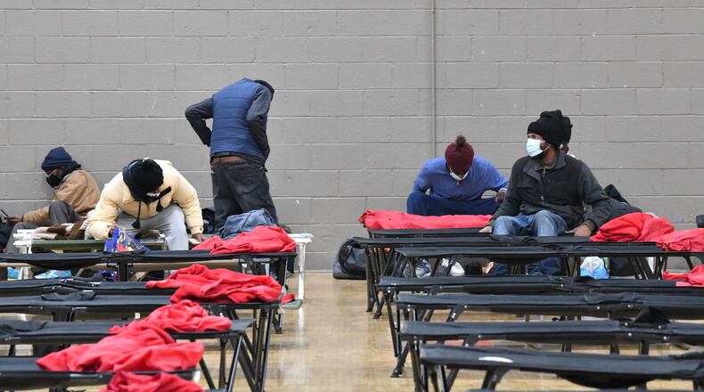 December 22, 2022 Atlanta - People get settled at the Old Adamsville Recreation Center warming center on Thursday, December 22, 2022. The City of Atlanta recently announced to open multiple warming centers as temperatures drop across metro Atlanta. (Hyosub Shin / Hyosub.Shin@ajc.com)