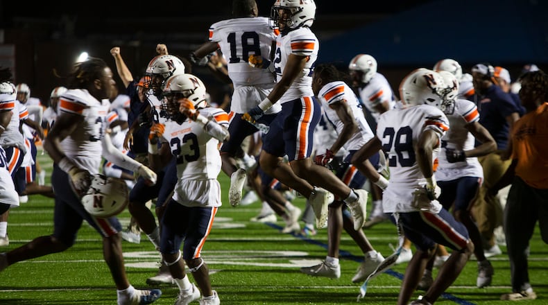 Members of the Northside high school football team celebrate the victory during the North Cobb vs. Northside high school football game on Friday, September 16, 2022, in Kennesaw, Georgia. Northside defeated North Cobb 20-17. CHRISTINA MATACOTTA FOR THE ATLANTA JOURNAL-CONSTITUTION.