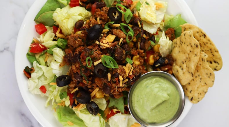 Perfectly Portioned Nutrition’s Turkey Taco Salad with Avocado Crema. (Courtesy of Kay Social)