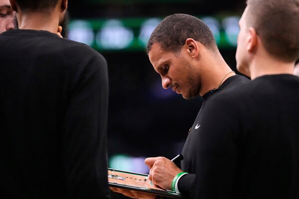 Boston Celtics head coach Joe Mazzulla draws up a play against the Boston Celtics during the first half of Game 5 of an NBA basketball second-round playoff series, Wednesday, May 14, 2025, in Boston. (AP Photo/Charles Krupa)