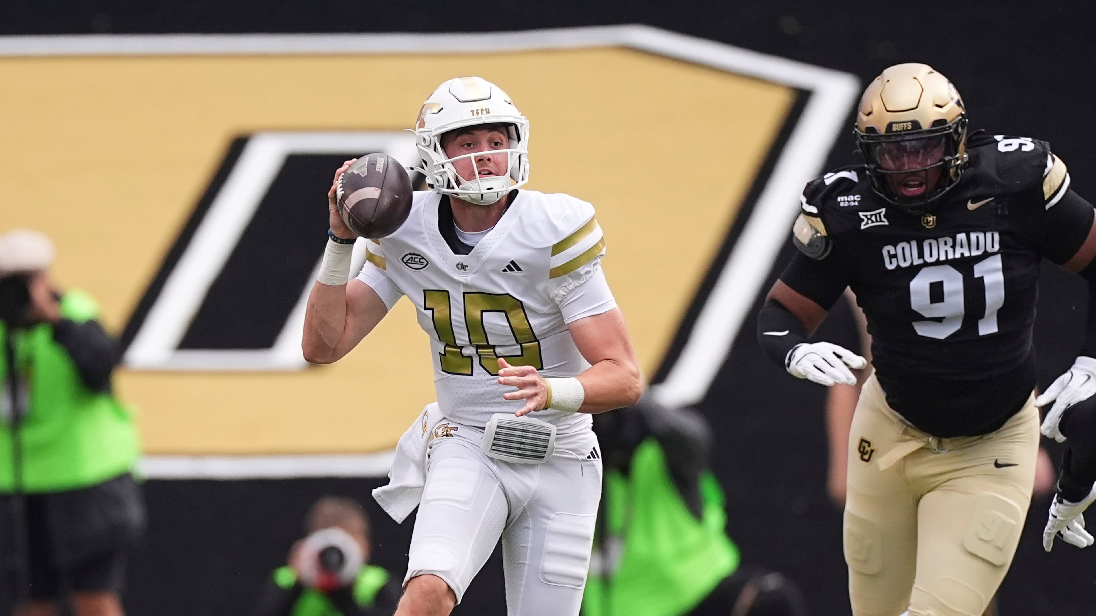 Tech quarterback Haynes King (left) looks to pass the ball as Colorado defensive end Brandon Davis-Swain pursues on Friday, Aug. 29, 2025, in Boulder, Colo. King capped the impressive showing with his game-winning, 45-yard touchdown run with 1:07 left on the clock in the fourth quarter. (David Zalubowski/AP)