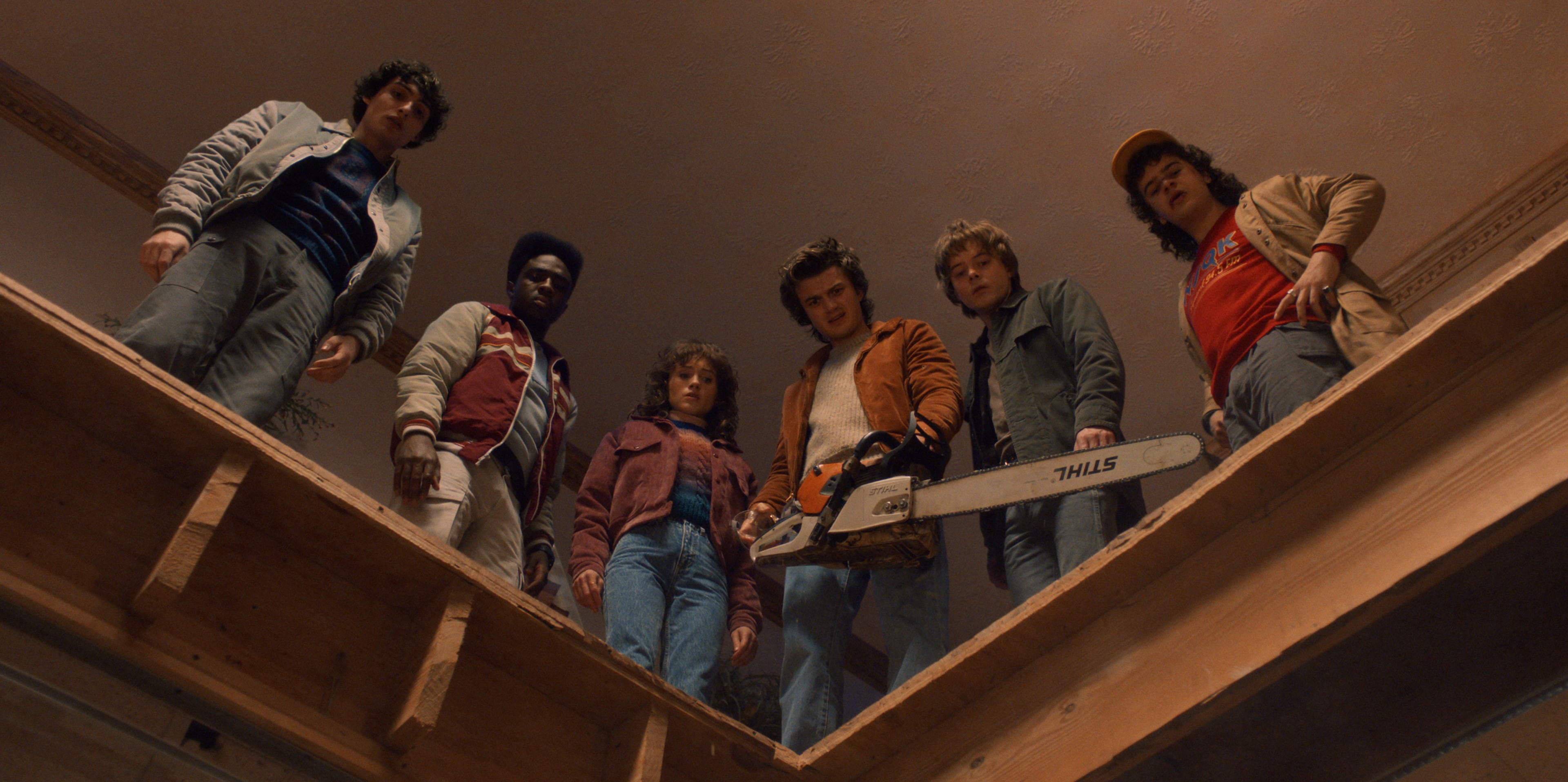 Finn Wolfhard as Mike Wheeler (from left), Caleb McLaughlin as Lucas Sinclair, Natalia Dyer as Nancy Wheeler, Joe Keery as Steve Harrington, Charlie Heaton as Jonathan Byers, and Gaten Matarazzo as Dustin Henderson in "Stranger Things" Season 5. (Courtesy of Netflix)