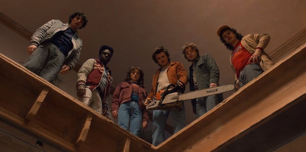 Finn Wolfhard as Mike Wheeler (from left), Caleb McLaughlin as Lucas Sinclair, Natalia Dyer as Nancy Wheeler, Joe Keery as Steve Harrington, Charlie Heaton as Jonathan Byers, and Gaten Matarazzo as Dustin Henderson in "Stranger Things" Season 5. (Courtesy of Netflix)