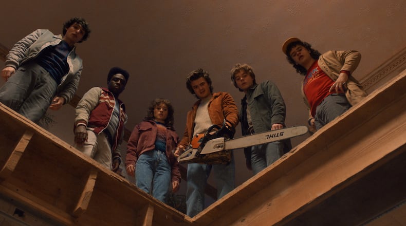 (L to R) Finn Wolfhard as Mike Wheeler, Caleb McLaughlin as Lucas Sinclair, Natalia Dyer as Nancy Wheeler, Joe Keery as Steve Harrington, Charlie Heaton as Jonathan Byers, and Gaten Matarazzo as Dustin Henderson in "Stranger Things: Season 5." (Courtesy of Netflix)