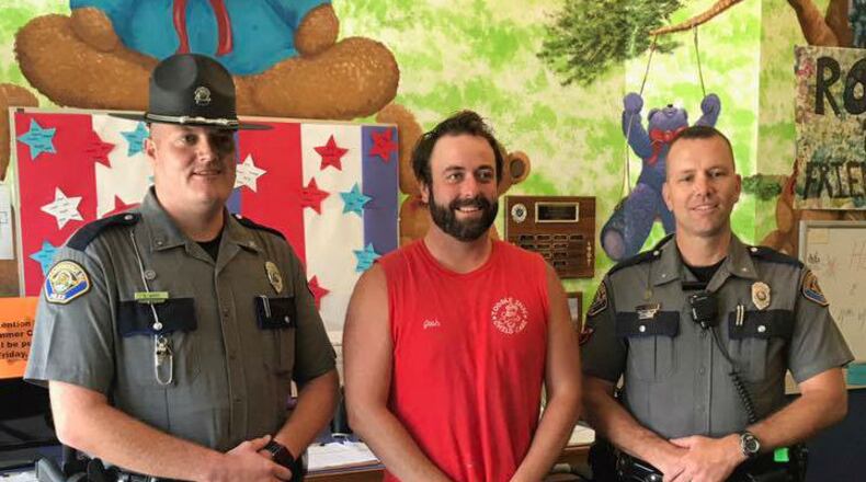 Joshua Galvin, a preschool teacher at Toddle Inn Child Care in South Portland, Maine, is honored Thursday, July 6, 2017, for saving the lives of 25 of the center's students. Galvin and the children were on a trip Wednesday when their bus driver suffered a heart attack at the wheel.