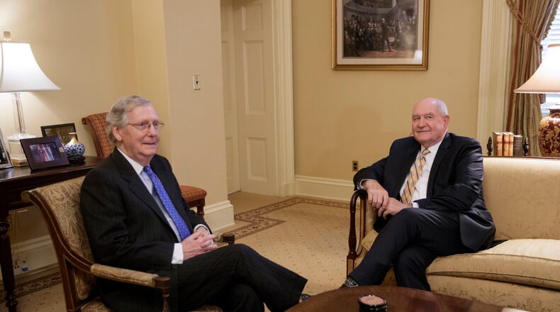 Senate Majority Leader Mitch McConnell of Ky., left, meets with Agriculture nominee Sonny Perdue on Capitol Hill in Washington last month. AP /J. Scott Applewhite
