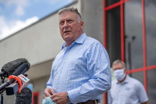FILE - Georgia Insurance and Safety Fire Commissioner John King makes a statement and answers questions from the media following a tour of Fieldale Farms while visiting Gainesville, Ga., May 15, 2020. (Alyssa Pointer/Atlanta Journal-Constitution via AP, File)