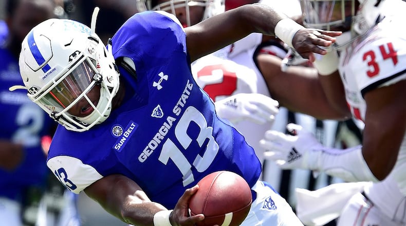 Dan Ellington of the Georgia State Panthers stretches for extra yardages as he scrambles against the North Carolina State Wolfpack during their game at Carter-Finley Stadium on September 8, 2018 in Raleigh, North Carolina. (Photo by Grant Halverson/Getty Images)