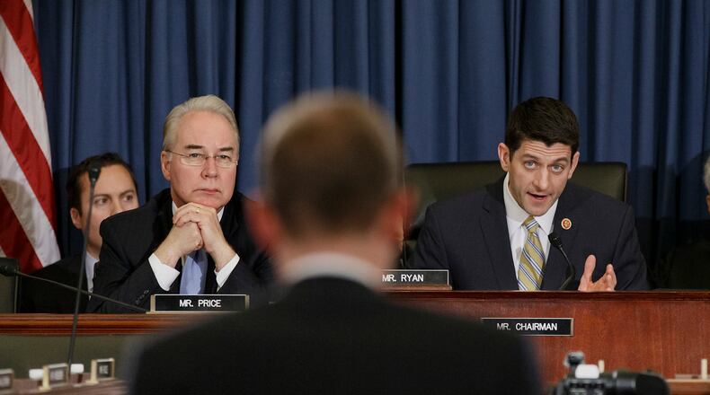 In this Feb. 5, 2014 file photo, then-Rep. Tom Price, R-Ga. listens at left as then-House Budget Chairman Rep. Paul Ryan, R-Wis., right, questions Congressional Budget Office (CBO) Director Douglas Elmendorf on Capitol Hill in Washington. (AP Photo/J. Scott Applewhite, File) U.S. Reps. Tom Price, R-Roswell, and Paul Ryan, R-Wis., at a Budget Committee hearing last year. (AP/J. Scott Applewhite)