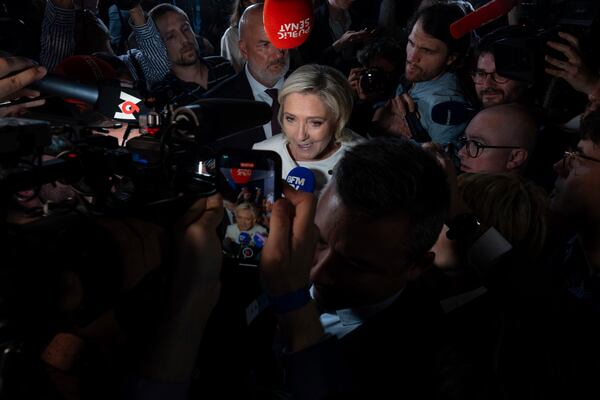 FILE - Far-right National Rally party leader Marine Le Pen answers reporters after the second round of the legislative election, July 7, 2024, at the party election night headquarters in Paris. (AP Photo/Louise Delmotte, File)
