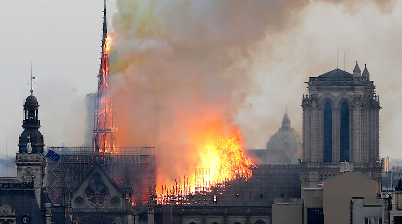 Flames rise from Notre Dame cathedral as it burns in Paris on Monday, April 15, 2019. AP/Thibault Camus