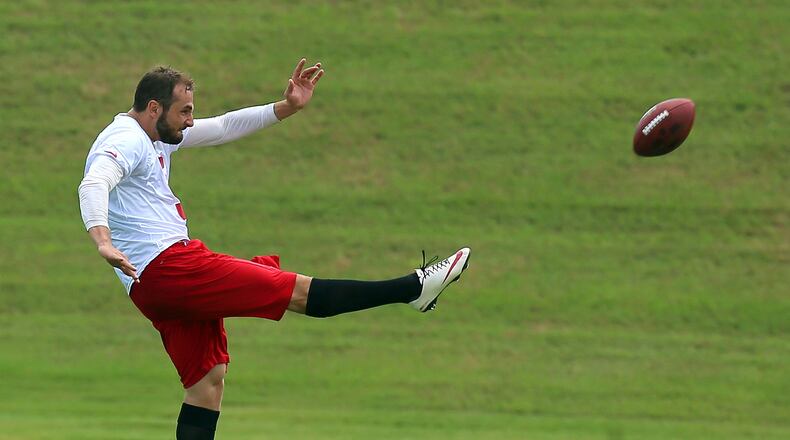 061113 FLOWERY BRANCH: Falcons punter Matt Bosher gets off a punt during team practice on Tuesday, June 11, 2013, in Flowery Branch. CURTIS COMPTON / CCOMPTON@AJC.COM
