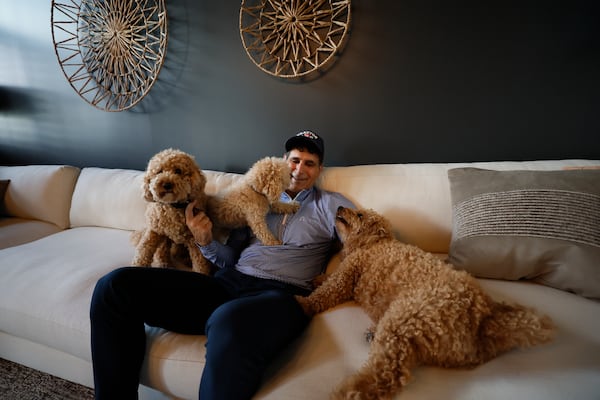 Jared Mula didn't mean to get three dogs. But now he has them anyway. Juice is on the left, Herbie in the middle and Juju on the right.
(Miguel Martinez/AJC)