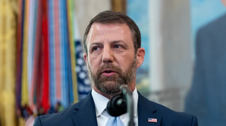 Homeland Security Secretary Markwayne Mullin speaks in the Oval Office of the White House, Tuesday, March 24, 2026, in Washington. (AP Photo/Alex Brandon)