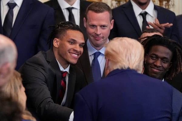 President Donald Trump shakes hands with Will Richard as he hosts the 2025 NCAA Champion, University of Florida men's basketball team in the East Room of the White House, Wednesday, May 21, 2025, in Washington. (AP Photo/Julia Demaree Nikhinson)