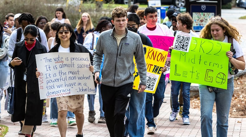 Students march to the polling site on Emory University’s campus during a Vote Early Day party on Oct. 28, 2022. (Steve Schaefer/The Atlanta Journal-Constitution/TNS)