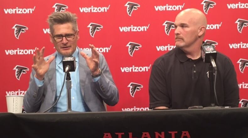 Falcons general manager Thomas Dimitroff and head coach Dan Quinn discussing the draft on Thursday, April 21, 2016. (By D. Orlando Ledbetter/dledbetter@ajc.com)