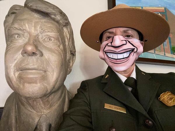 Jill Stuckey, superintendent of the Jimmy Carter National Historic Site wearing a Jimmy Carter mask in honor of his 96th birthday.