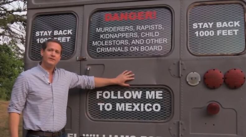 Michael Williams, GOP candidate for governor, and his "deportation bus." AJC file