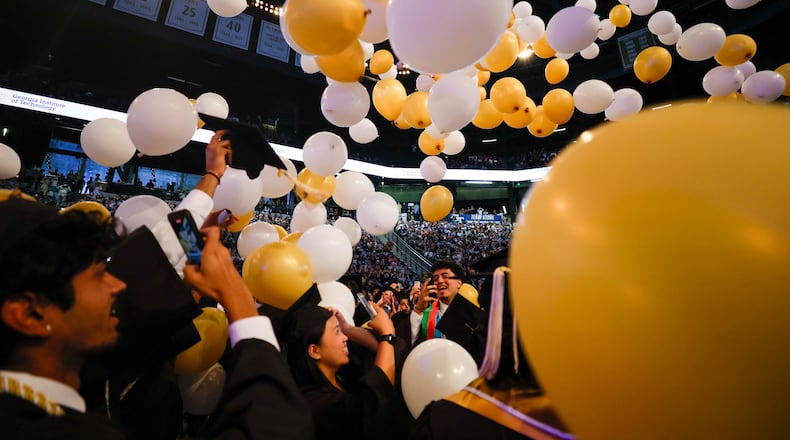 Georgia Tech graduates celebrate at the end of their commencement ceremony at the McCamish Pavilion on Thursday, May 7, 2026, in Atlanta. Universities across the state are increasingly offering more AI classes in hopes of preparing students for a changing job market. (Miguel Martinez/AJC)