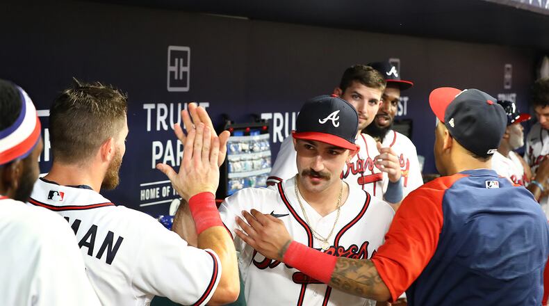 Braves starting pitcher Spencer Strider celebrates with teammates in the dugout after striking out sixteen breaking the Atlanta Braves' franchise record for strikeouts in a single game, setting down 16 Colorado Rockies over eight innings in a MLB baseball game on Thursday, Sept. 1, 2022, in Atlanta. “Curtis Compton / Curtis Compton@ajc.com