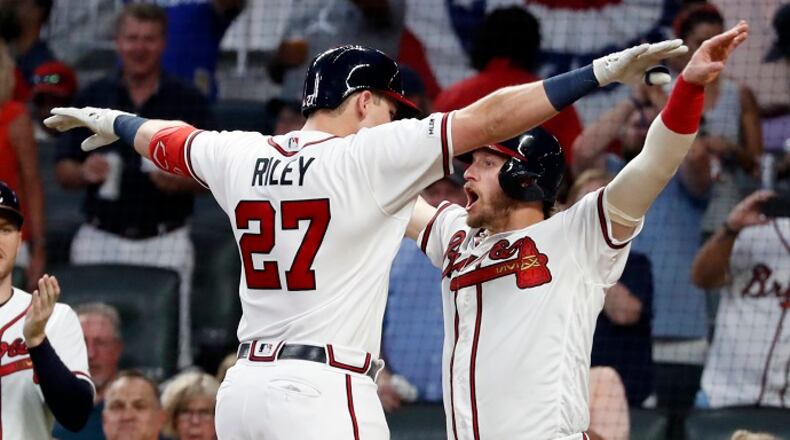 Atlanta Braves' Austin Riley (27) celebrates with Josh Donaldson after hitting a three-run home run in the sixth inning of a baseball game against the Philadelphia Phillies Wednesday, July 3, 2019, in Atlanta. (AP Photo/John Bazemore)