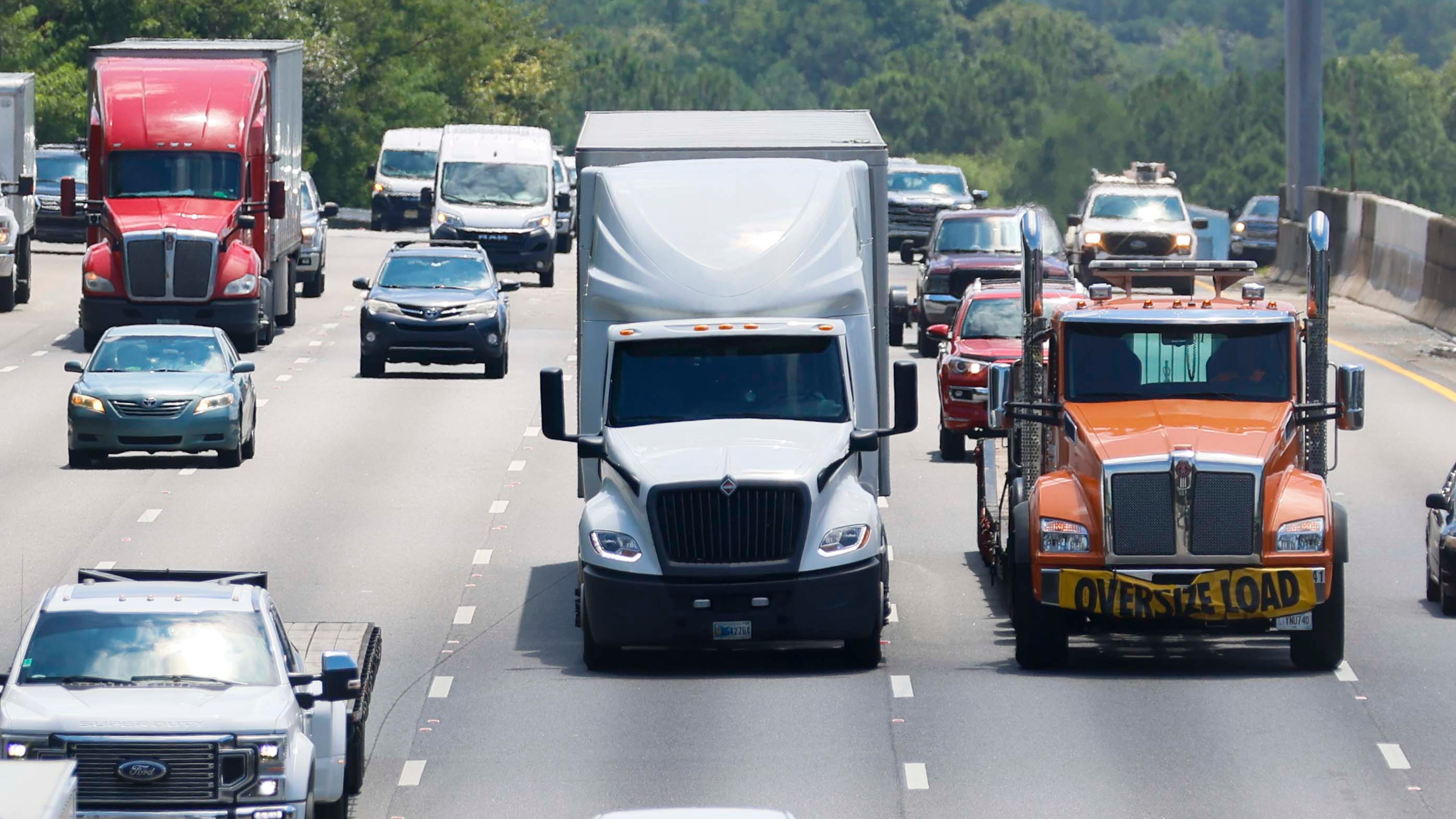 Truck drivers are observed traveling west on I-285 on Wednesday, August 6, 2025. Foreign-born truckers have raised concerns about the English proficiency requirements, especially as the Trump administration enforces a two-part test during roadside inspections. (Miguel Martinez/AJC)