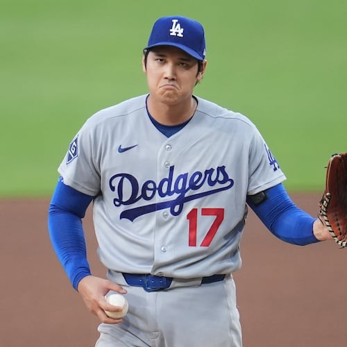 Los Angeles Dodgers starting pitcher Shohei Ohtani gestures as he works against a San Diego Padres batter during the fifth inning of a baseball game Wednesday, May 20, 2026, in San Diego. (AP Photo/Gregory Bull)
