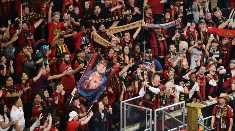 Atlanta United team owner Arthur Blank (lower right) kicks off the pregame ceremonies on Saturday, December 8, 2018. Rappers Big Boi and Waka Flocka are among those who have participated in the ritual of hammering the golden spike before a United game. (Photo: HYOSUB SHIN / HSHIN@AJC.COM)