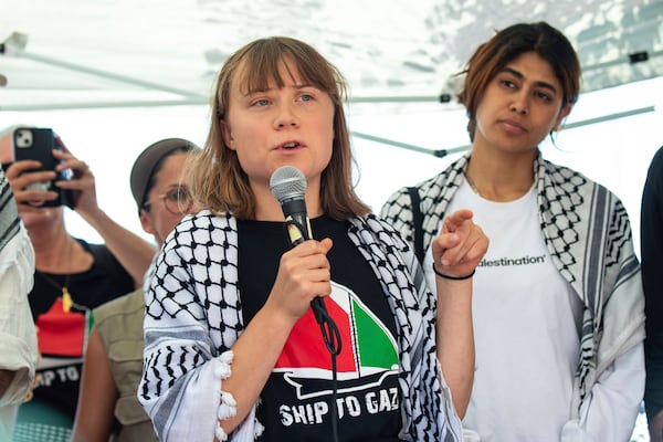 Climate activist Greta Thunberg with other activists from a human rights organization meets with journalists in Catania, Italy, Sunday, June 1, 2025, ahead of their departure for the Mideast. (AP Photo/Salvatore Cavalli)
