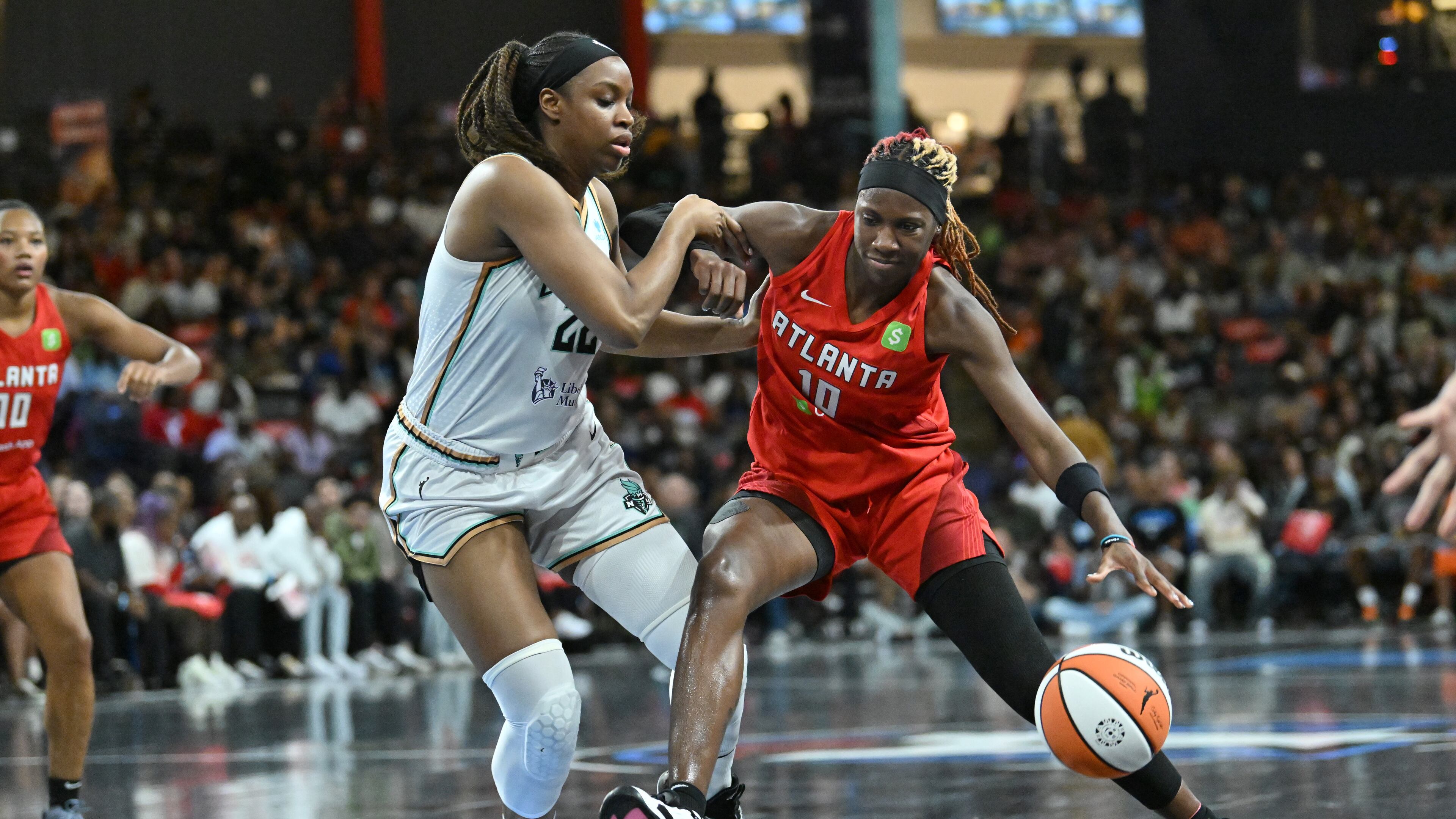 Atlanta Dream guard Rhyne Howard (10), who had 19 points in Wednesday's win over the Los Angeles Sparks, drives against New York Liberty forward Kennedy Burke (22) during the first half in a WNBA basketball game at Gateway Center Arena, Saturday, August 23, 2025, in Atlanta. (Hyosub Shin/AJC)
