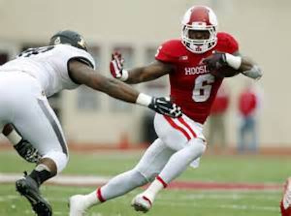 Indiana running back Tevin Coleman (6) fights to break free from Purdue's Jalani Phillips (89) during the second half of an NCAA college football game at Memorial Stadium in Bloomington, Ind., Saturday, Nov. 29, 2014.