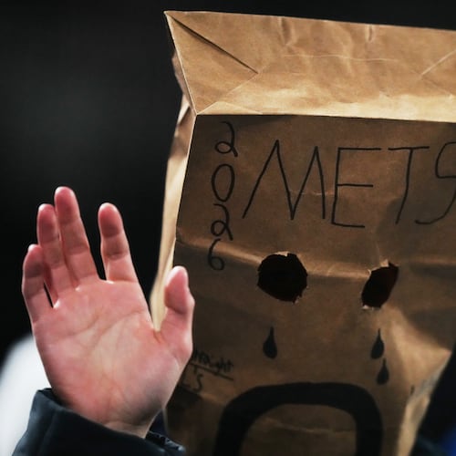 A New York Mets fan watches during the eighth inning of a baseball game against the Minnesota Twins Tuesday, April 21, 2026, in New York. (AP Photo/Frank Franklin II)