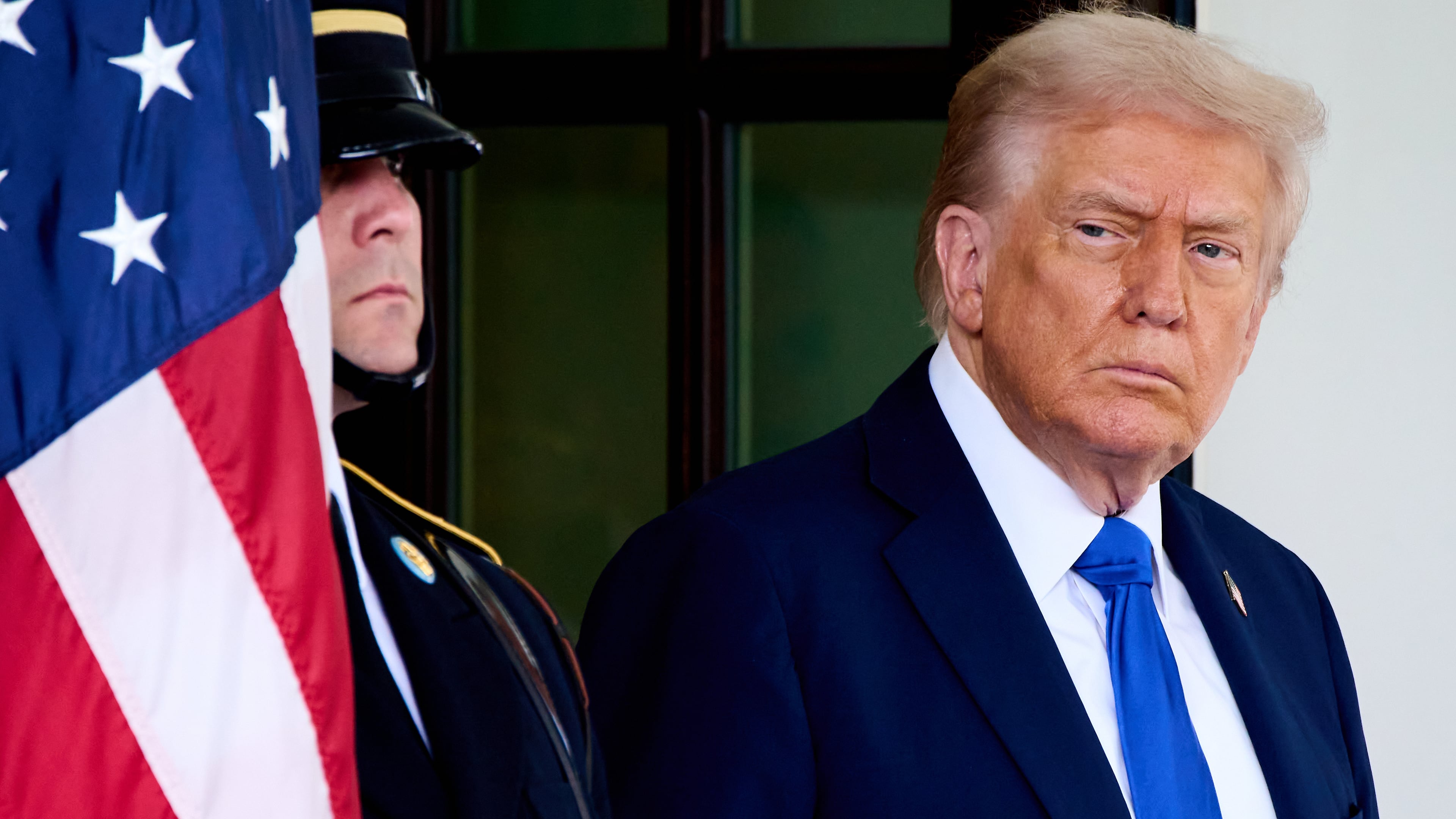 President Donald Trump waits to greet Canada's Prime Minister Mark Carney, as Carney arrives at the White House, Tuesday, Oct. 7, 2025, in Washington. (AP Photo/Jacquelyn Martin)