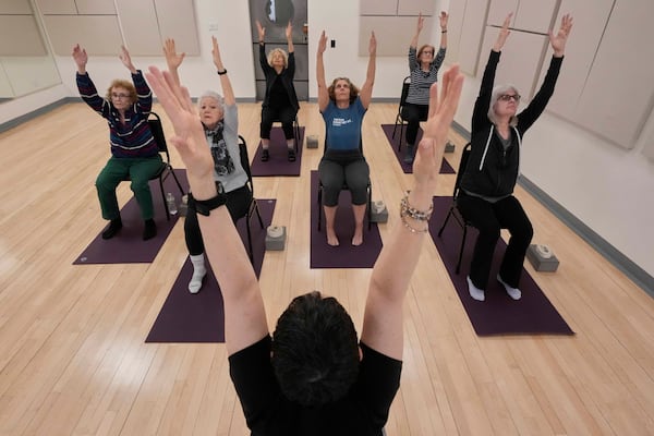 Whitney Chapman, foreground center, conducts a chair yoga class at the Marlene Meyerson JCC Manhattan, in New York, March 28, 2025. (AP Photo/Richard Drew)