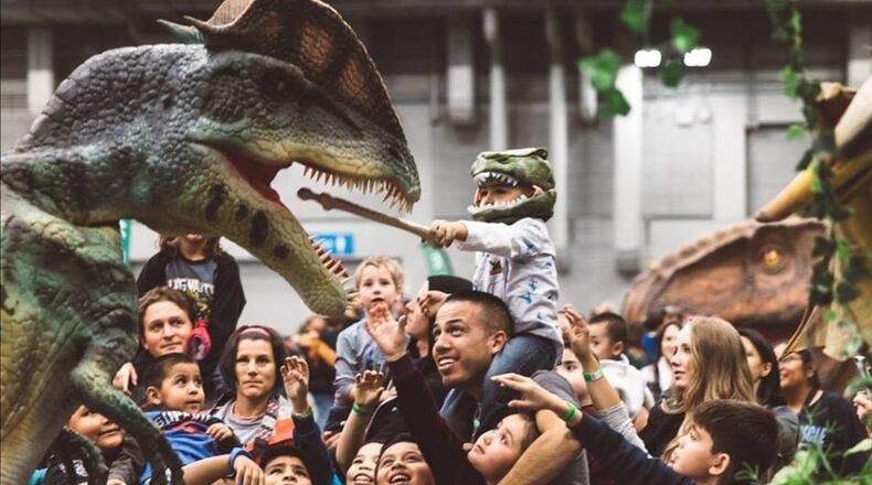 Get up close and touch (or even ride) life-like animatronic dinosaurs at Jurassic Quest. (Courtesy)